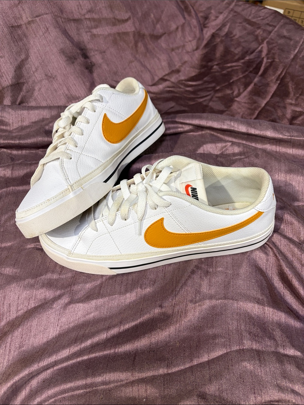 Nike White Sneakers with Orange Swoosh